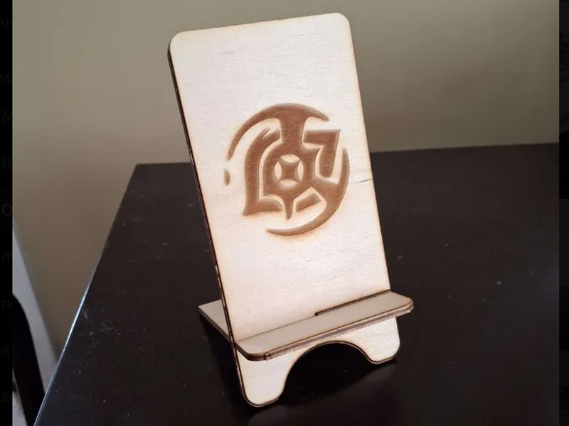 The phone holder, assembled. it's quite sturdy (since it's made out of wood). Being able to see something I made get real is always interesting and its the sort of thing I want to do more of.