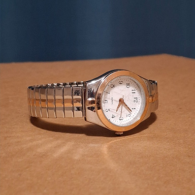 I believed that his watch, if you broke it down, could've been straightforward to model in theory. The clock could be made with a couple cylinders, and the band part could have been made of one model and cloned in a circle.